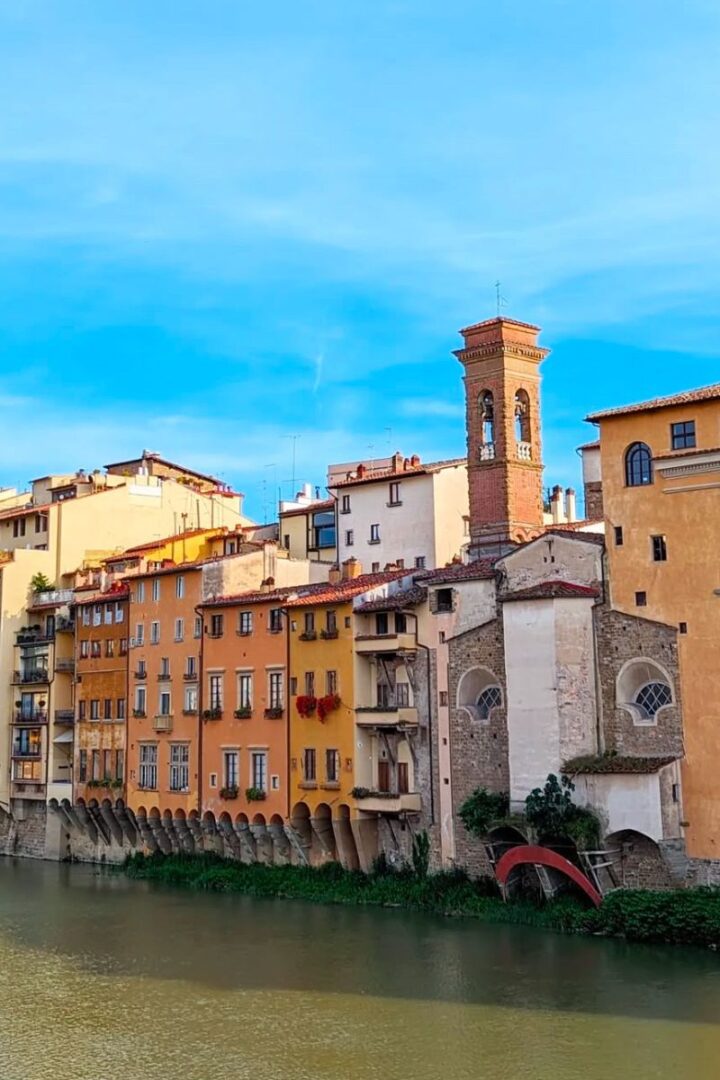 colorful buildings along the arno river in florence