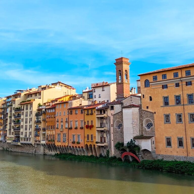 colorful buildings along the arno river in florence