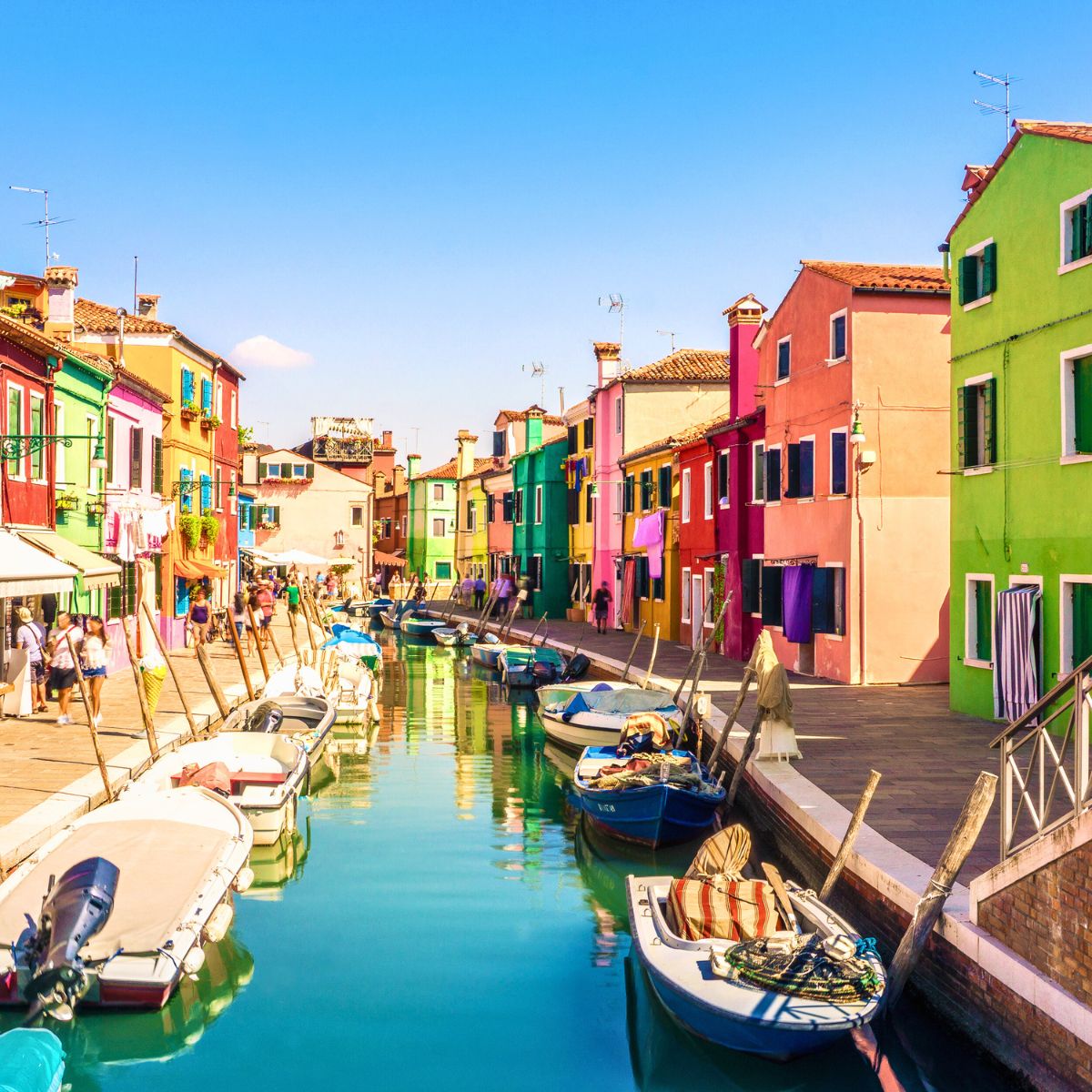 pastel colored buildings on a canal in Burano Venice