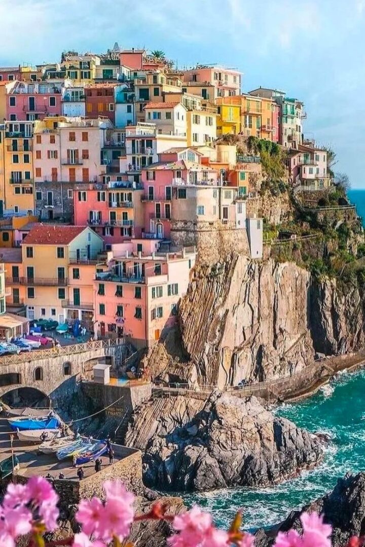 overhead shot of cliffside town with colorful pastel buildings in Cinque Terre