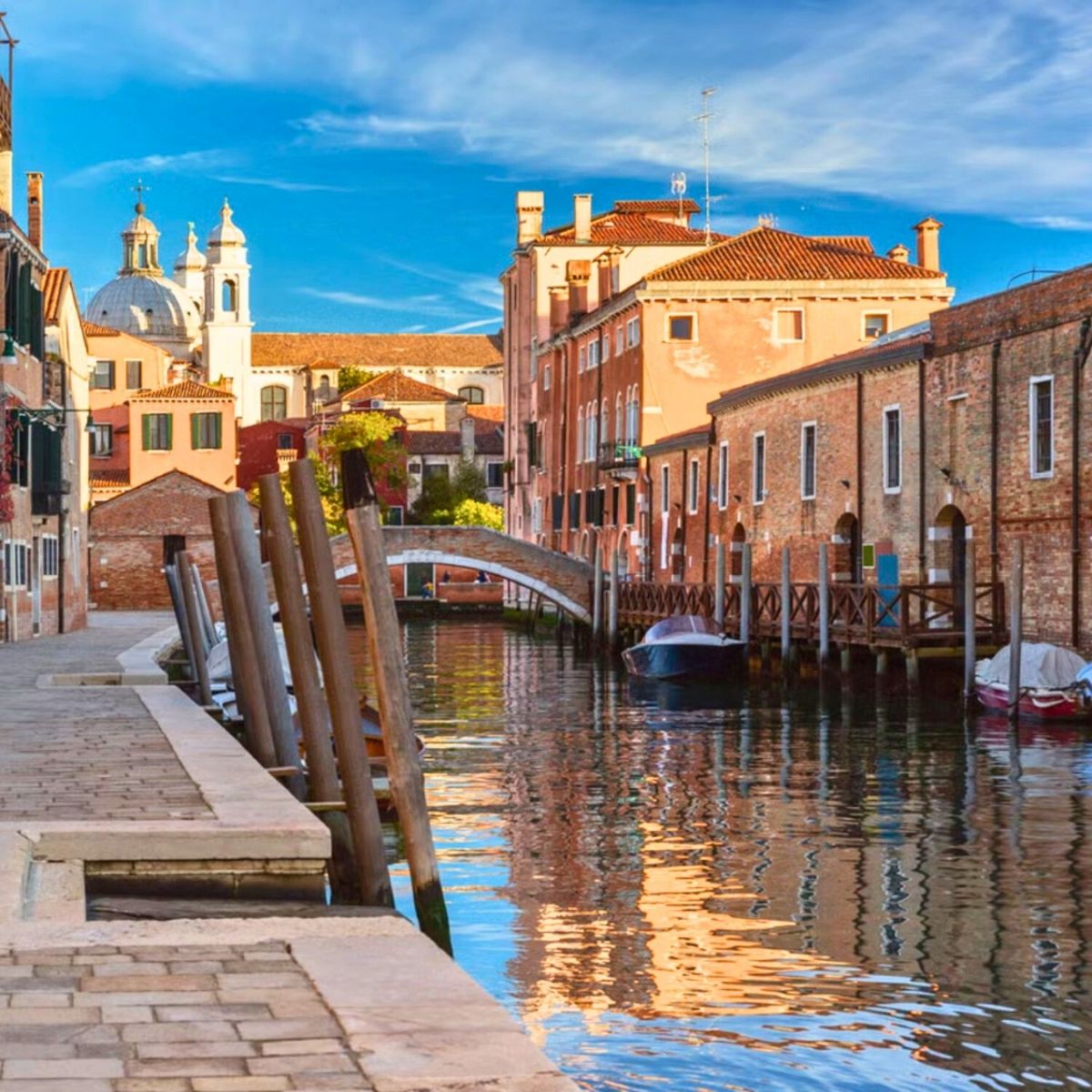quiet canal in Venice surrounded by buildings