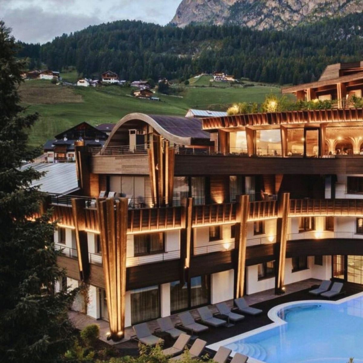 wooden lodge in the mountains all lit up