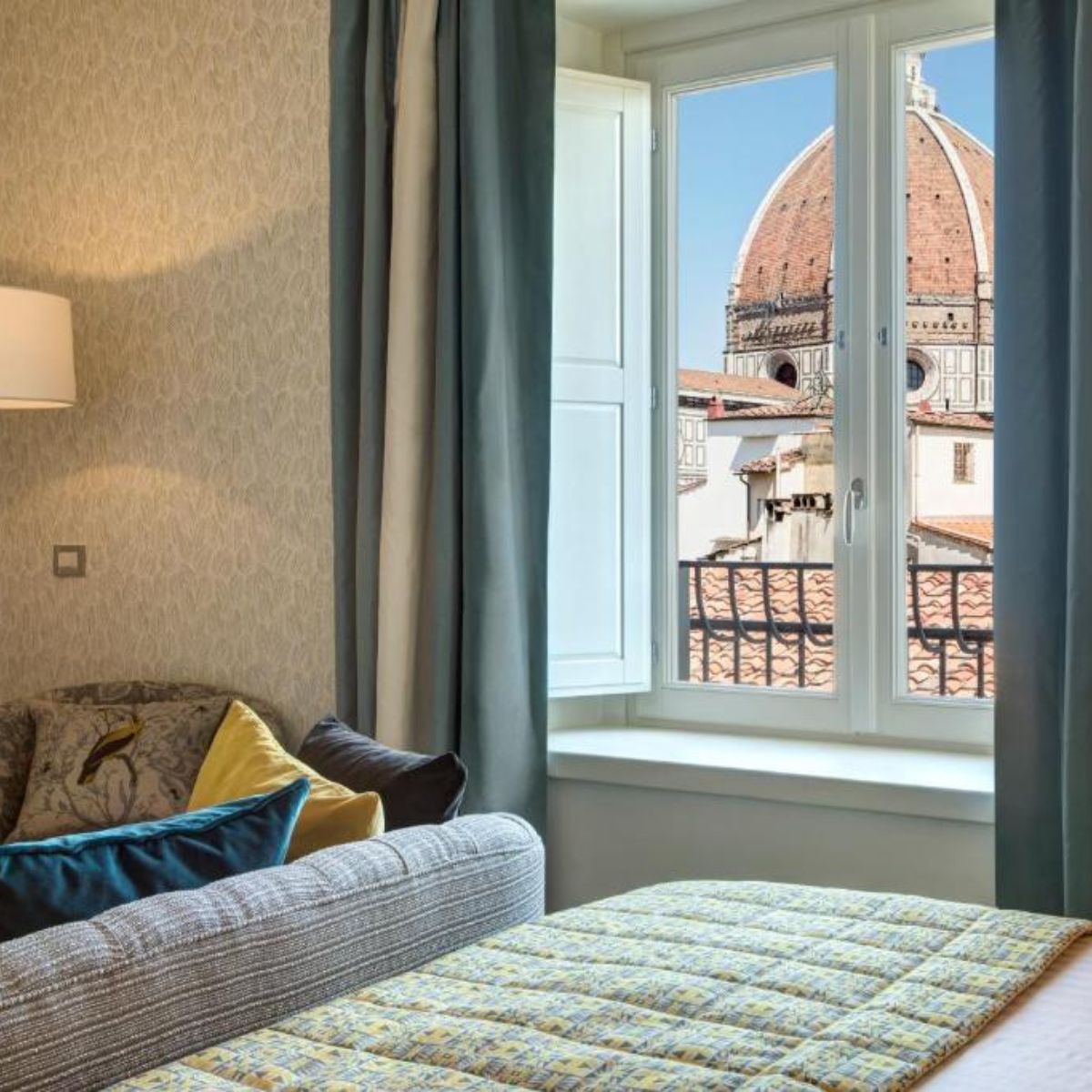 hotel room with the dome of the Florence Duomo out the window