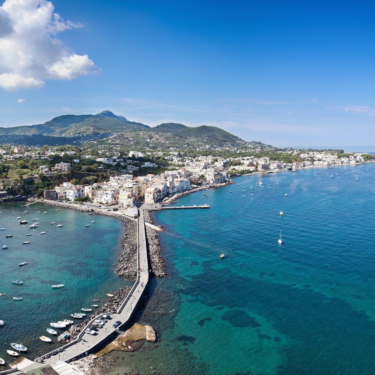 view from above with the sea and green mountains in the background