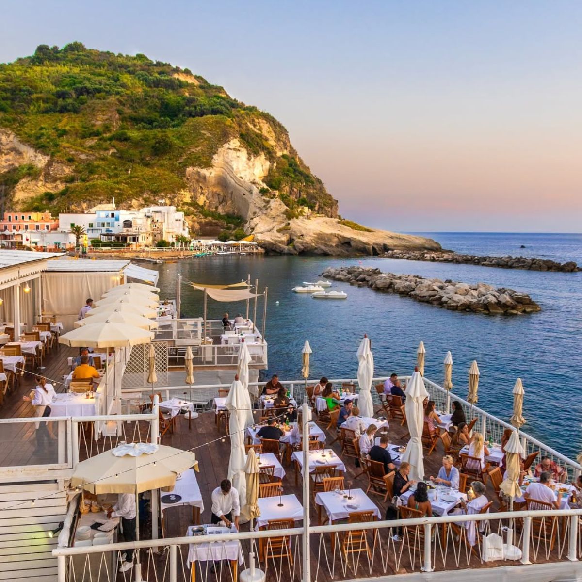 restaurant on the see with an outdoor patio full of tables