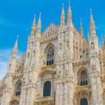 the duomo in milan with a blue sky in the background