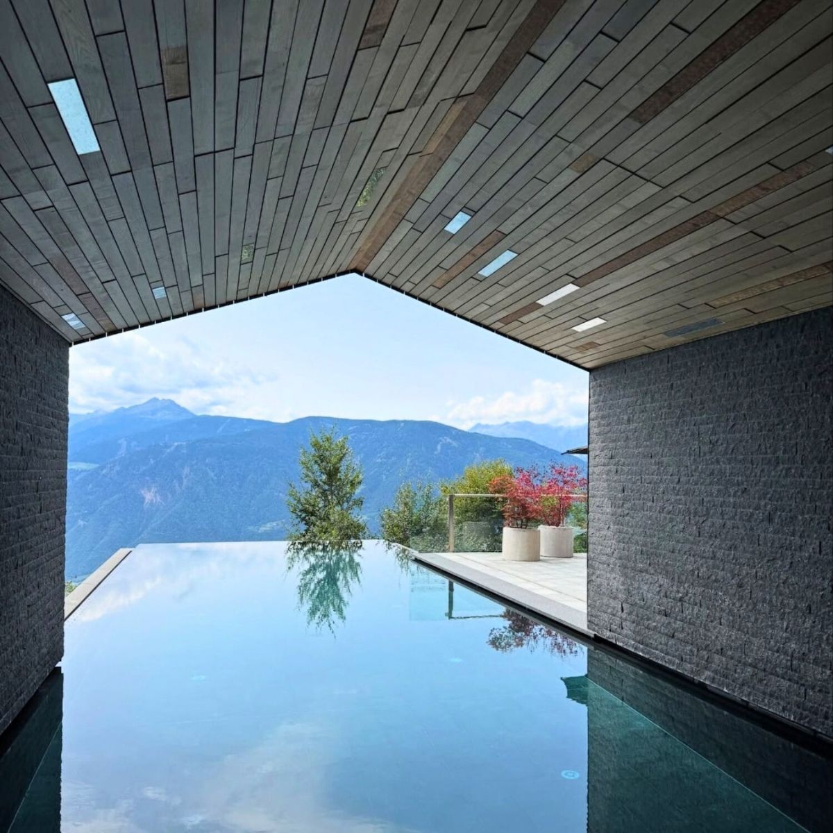 infinity pool overlooking the green mountains