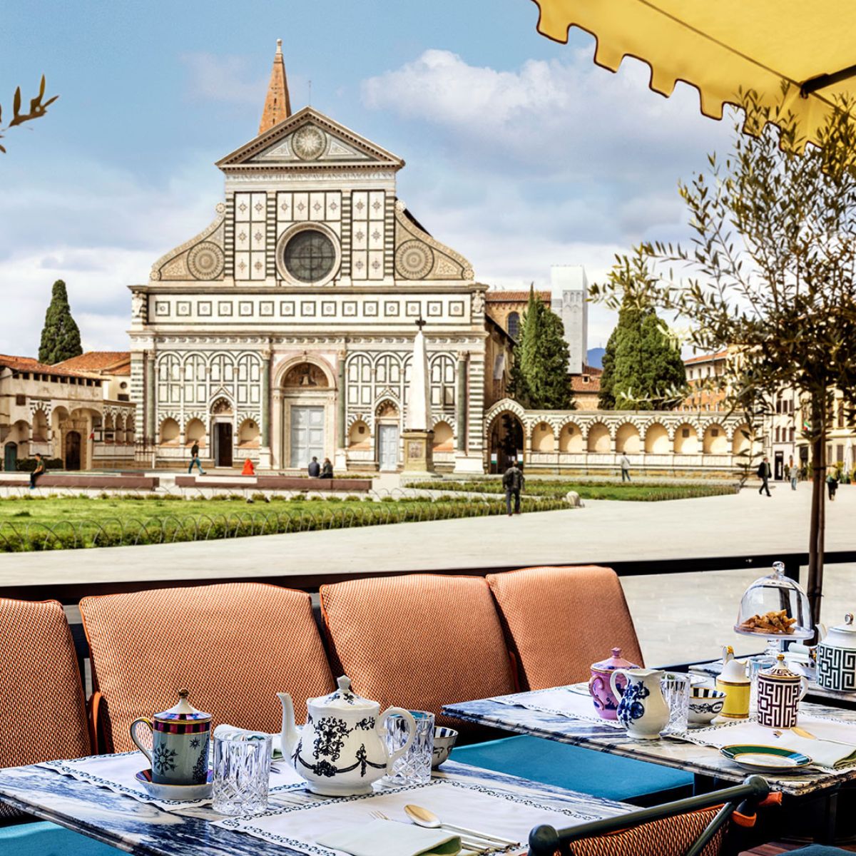 outdoor dining patio with the Santa Maria Novella church in the background