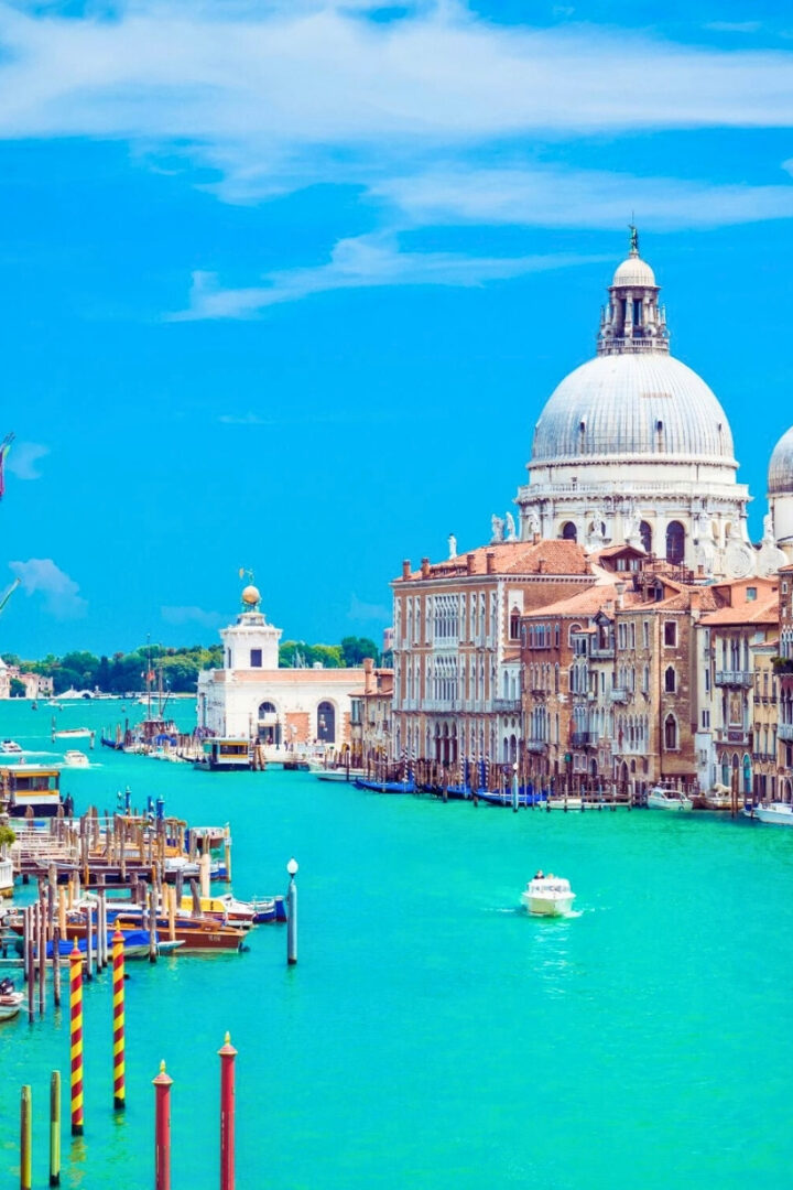 sunny day in venice with boats cruising the Grand Canal