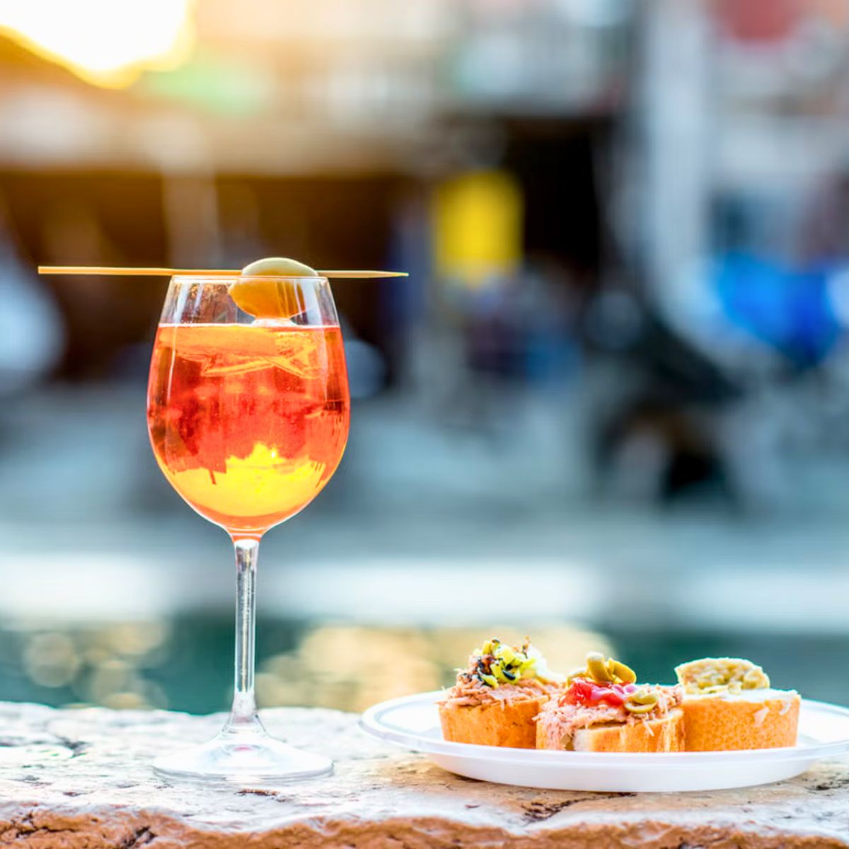 picture of aperol spritz and chichetti on a plate