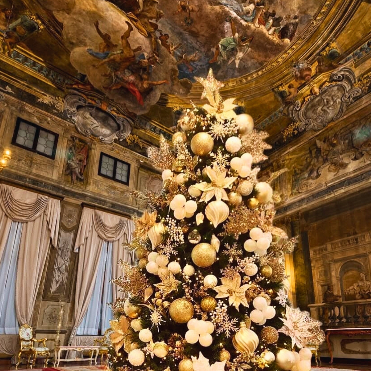 gold christmas tree in a palace with painted ceilings