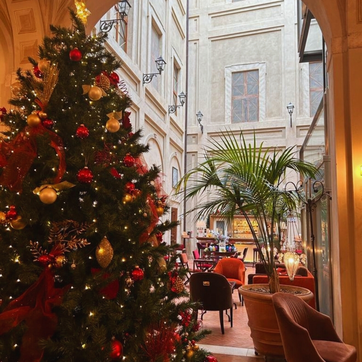 christmas tree with red ornaments in a hotel lobby