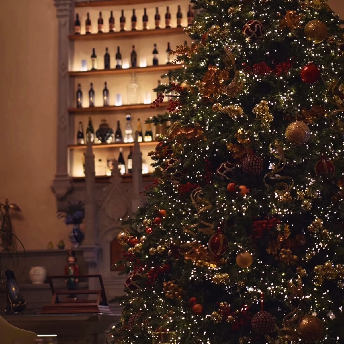 christmas tree with lighted bar in the background