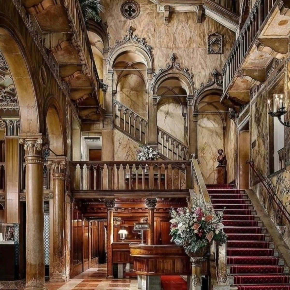 Elegant villa staircase with ornate woodwork and marble walls at Hotel Danieli Venice