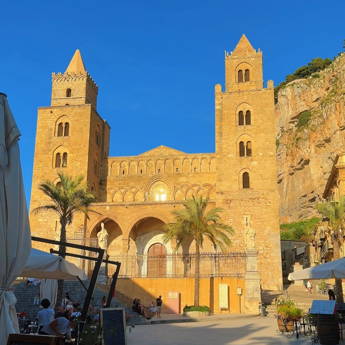 La Rocca cliff and Norman Cathedral rising above Cefalù, Sicily