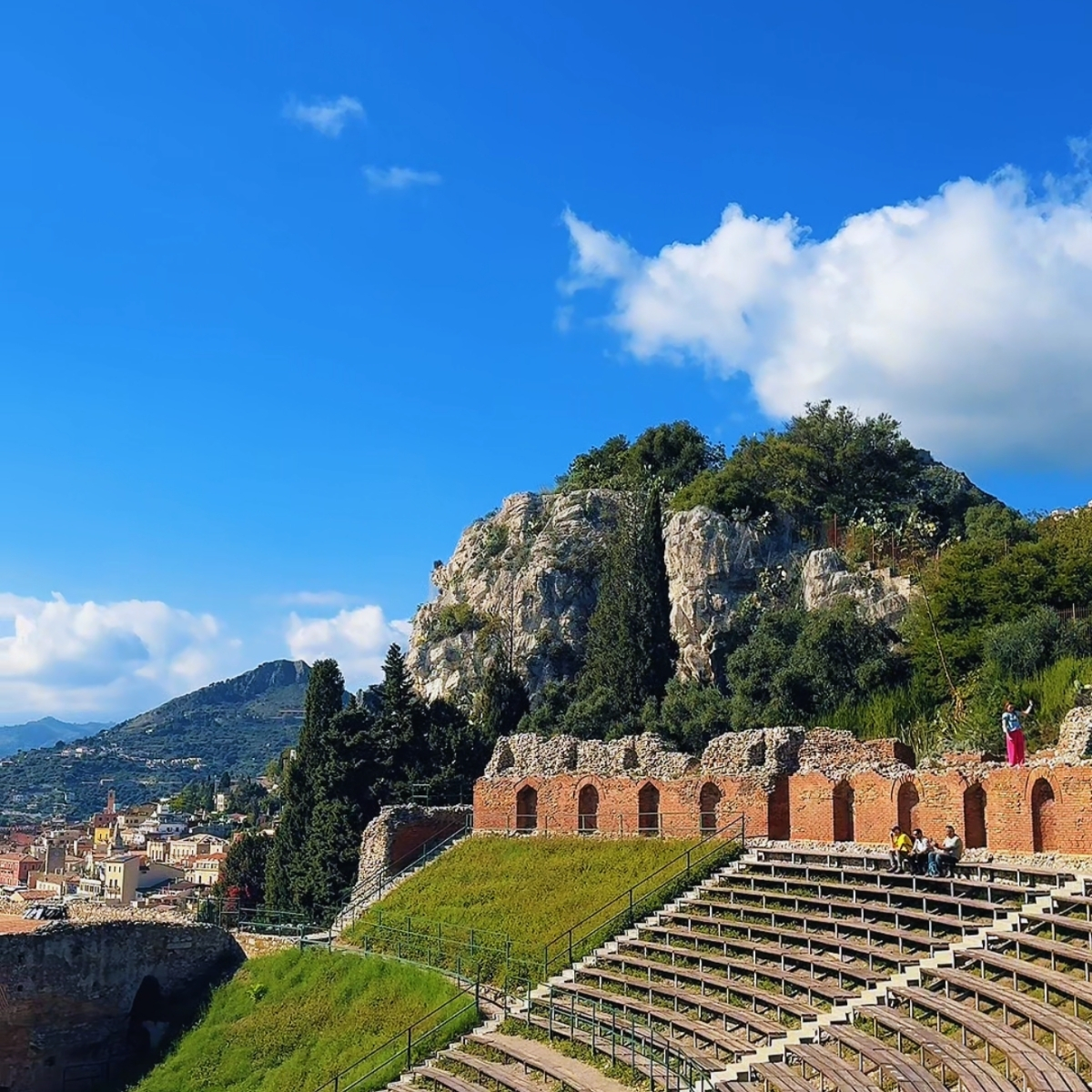Teatro Antico — ancient Greek theatre in Taormina with Mount Etna and Ionian Sea backdrop