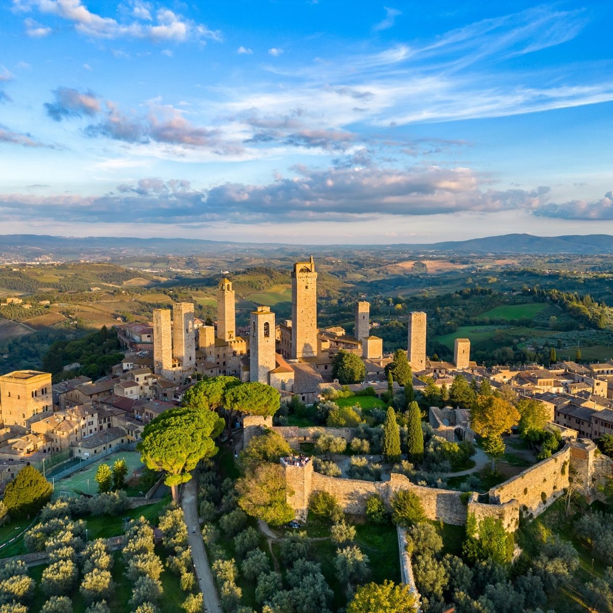 San Gimignano medieval towers rising above the Tuscan countryside