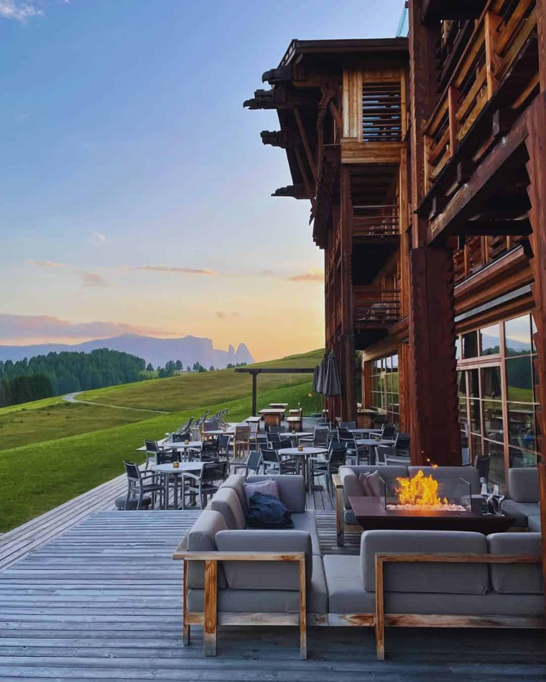 Adler Lodge Ritten glass-walled forest chalets above Bolzano South Tyrol in fall