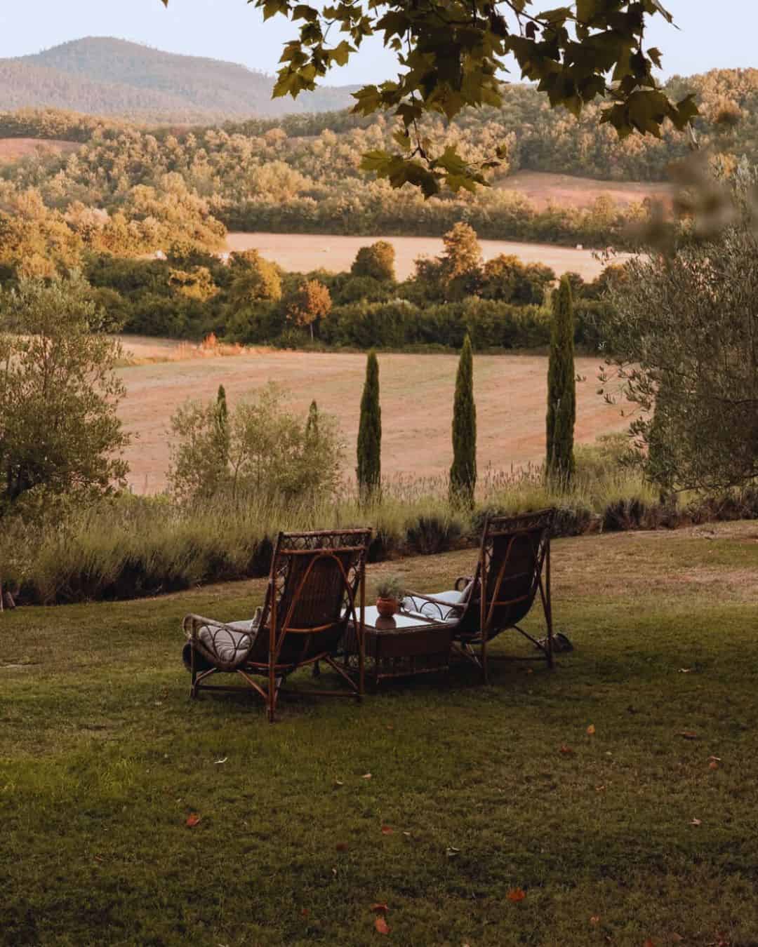 Borgo San Pietro 13th-century Chianti manor hotel with vineyards during grape harvest