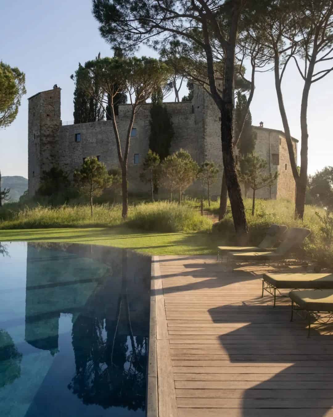 Castello di Reschio 1000-year-old castle hotel in Umbria surrounded by fall foliage and oak forest